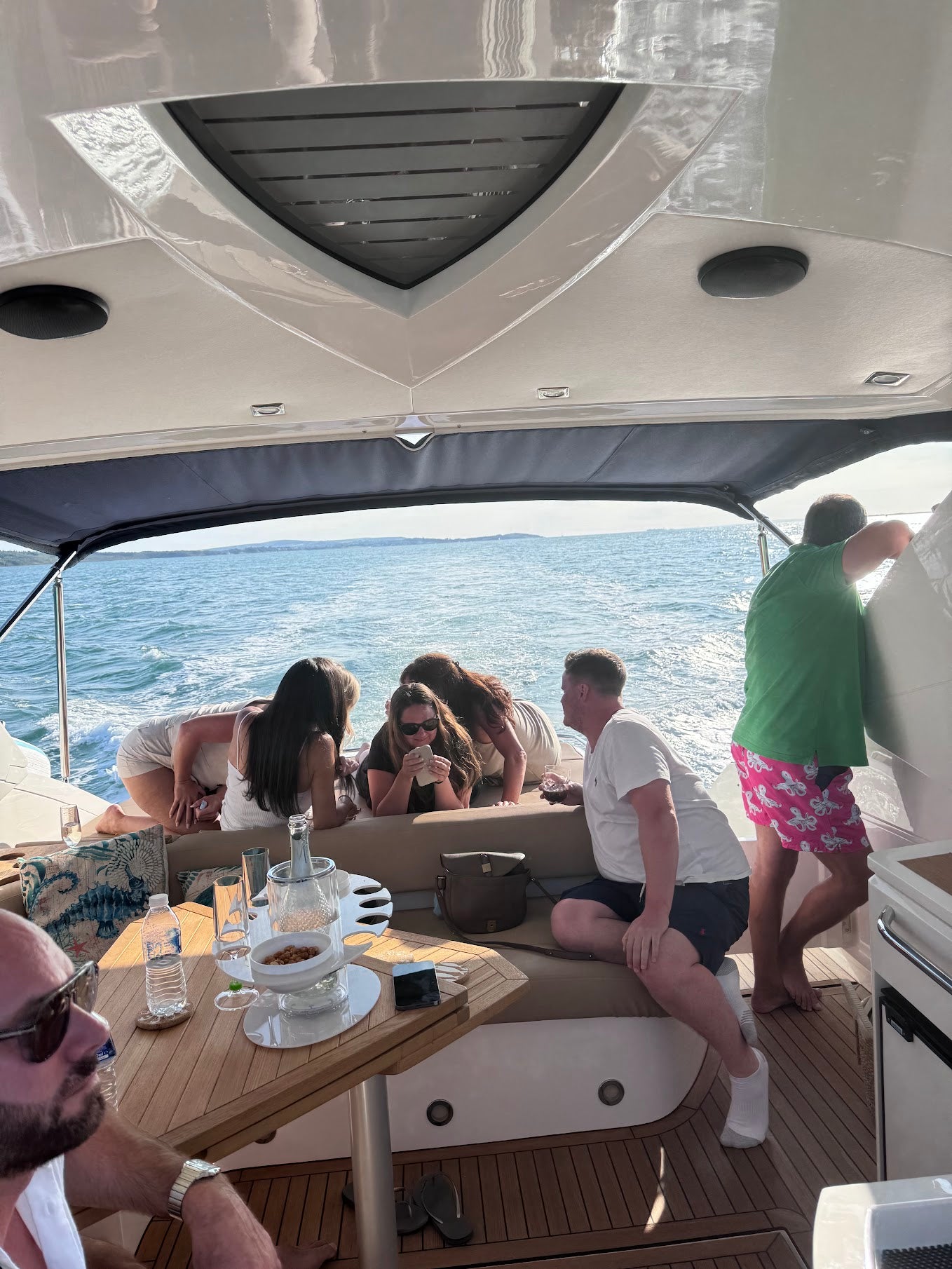 charter guest sat on boat enjoying the cruise