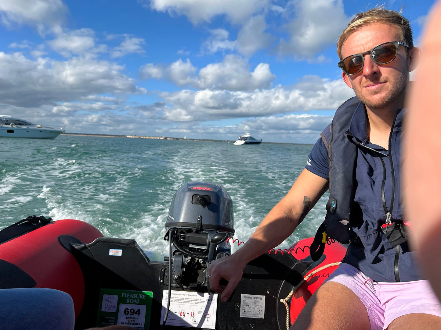 taking a tender boat to the hut colwell bay from the yacht charter